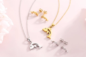 Detailed view of dolphin jewelry sets in gold and silver finish with tiny crystals