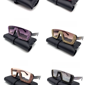 Close-up of semi-rimless oversized sunglasses with sparkling rhinestones in multiple colors