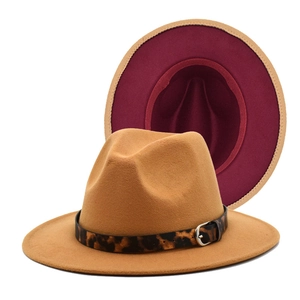 Detail of camel fedora hat featuring red lining and leopard print belt with silver buckle