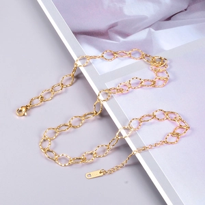 Detail of gold oval link necklace with lobster clasp, extender chain and K18 tag