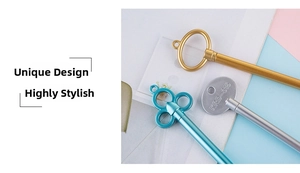 Detail of creative vintage key shaped neutral pens in gold, silver and blue finishes