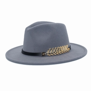 Detail of grey-blue wool fedora featuring black leather band and gold wheat ear pin