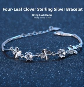 Detailed close-up of s925 silver four-leaf clover bracelet with zircon and lobster clasp
