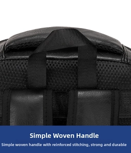 Detail of reinforced woven handle and precision stitching on the black leather backpack