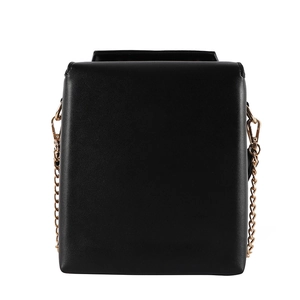 Detail of minimalist black rectangle crossbody bag with textured matte faux leather finish