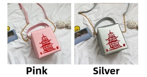 Detail of pink and silver square box bags with red pagoda print and chain strap