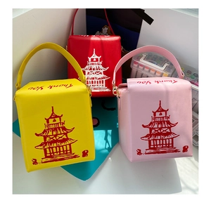 Detail of unique Chinese takeout box style PU leather cross-body bags with chain straps