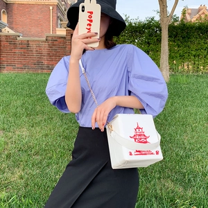 White PU leather box bag featuring a red Chinese pagoda print and gold chain strap
