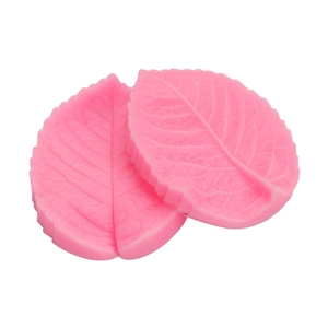Pink leaf-shaped silicone fondant mold with realistic vein texture for cake baking