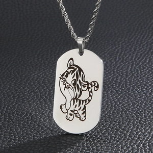 Oval stainless steel zodiac tiger necklace with twisted chain on leather background