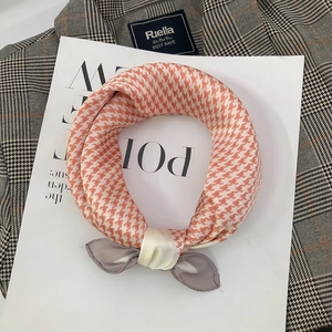 70x70cm orange houndstooth silk-like square scarf styled on a fashion magazine