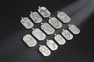 Detailed grid of stainless steel zodiac dog tags with laser-engraved animal designs