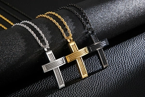 Three men's hip hop cross necklaces in silver, gold, and black with twisted chains