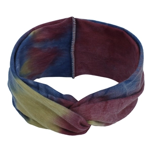 Detail view of tie-dye elastic headband with wide knot design in bohemian rainbow colors