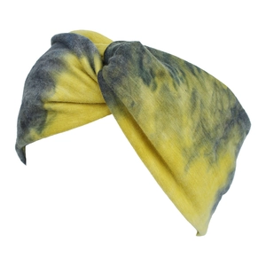 Detail view of yellow and grey tie-dye twisted headband with soft elastic knit texture