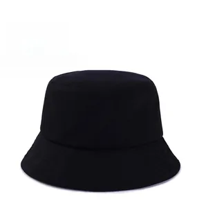 Detailed close-up of a minimalist black cotton bucket hat with a flat top and clean stitching