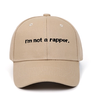 Detailed close-up of I'm not a rapper embroidery on khaki cotton baseball cap