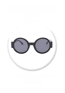 Detail view of round retro sunglasses featuring matte black frames and UV protective lenses