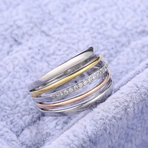 Three-tone multi-layered stackable ring with sparkling cubic zirconia in a minimalist style