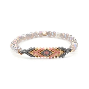 Detailed view of Miyuki beaded evil eye bracelet with grey faceted crystal beads