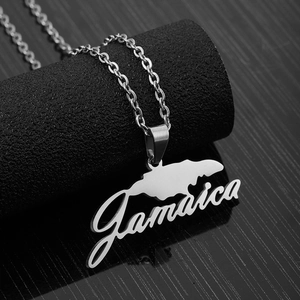 Detail of silver stainless steel Jamaica map pendant necklace on a black display stand
