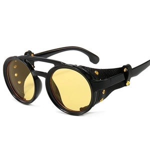 Steampunk round sunglasses with yellow lenses, black leather side shields and gold rivets