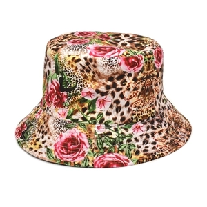 Close-up of leopard print sun hat with pink roses and golden baroque patterns