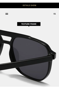 Detail view of double bridge design and polished black frame texture on square sunglasses