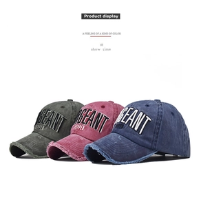 Close-up of vintage distressed baseball cap with 3D embroidery and frayed edge detail