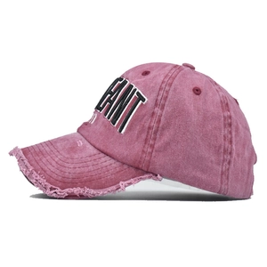Detail of distressed brim and 3D embroidered LEANT lettering on vintage washed cotton cap