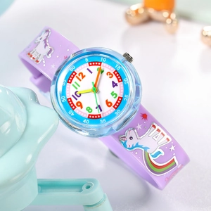 Macro shot of purple silicone watch strap featuring unicorn and rainbow print details