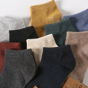 Men's wool blend crew socks in multiple solid colors featuring thick knit texture