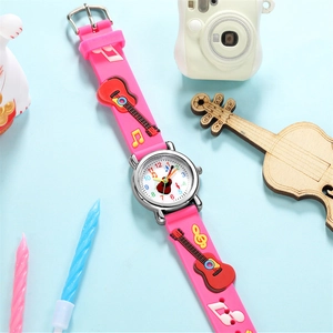 Detail of pink silicone children's watch featuring 3D embossed guitar and music note patterns