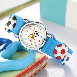 Macro view of blue silicone kids watch strap featuring 3D embossed soccer football patterns