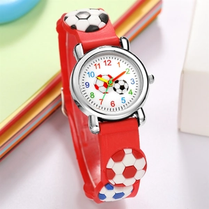Detailed view of kids sports watch with red silicone strap and 3D soccer pattern