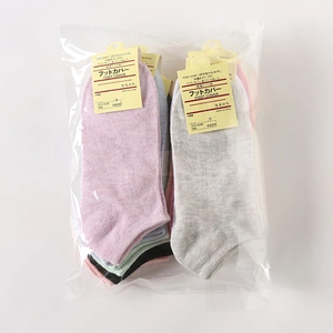 Detailed view of multi-color low-cut cotton foot cover socks in retail packaging