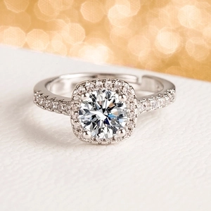 Adjustable silver halo engagement ring featuring a sparkling round zircon and micro-pavé band