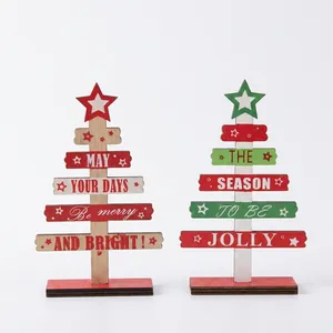 Detail of wooden DIY mini Christmas tree desktop ornaments with festive typography