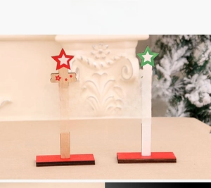 Detail of wooden DIY mini Christmas tree desktop ornaments with festive typography