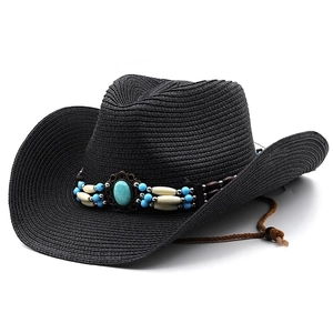 Detail of black straw cowboy hat with turquoise beads and adjustable chin strap