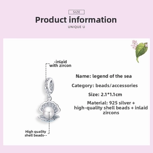 Détail macro du charm coquillage en argent S925 avec perle blanche et oxydes de zirconium