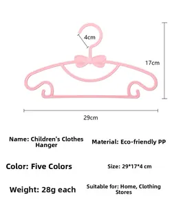 Gruccia per bambini rosa in PP con fiocco, dimensioni 29x17cm e ganci antiscivolo
