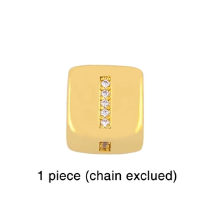 Detail of square gold-plated letter I pendant with white cubic zirconia stones