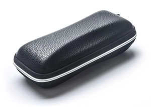 Macro shot of black litchi grain leather EVA hard case with durable silver metal zipper
