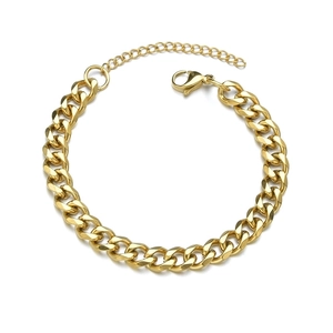 Polished golden stainless steel Cuban link bracelet with lobster clasp on white background