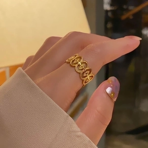 Vintage gold adjustable titanium steel ring with hollow lace pattern for women
