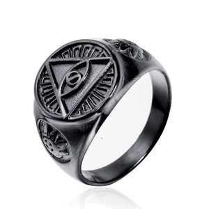 Macro detail of black vintage stainless steel All-Seeing Eye ring with sunburst carvings