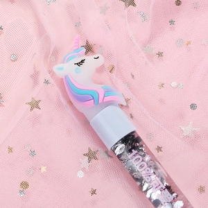 Creative unicorn gel pen with floating silver sequins and pink dreamy stardust background