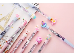 Detail of cute cartoon glitter pens with floating sequins and animal toppers on pink background