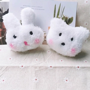 Cute plush bear and rabbit brooches with pink blush details on floral fabric